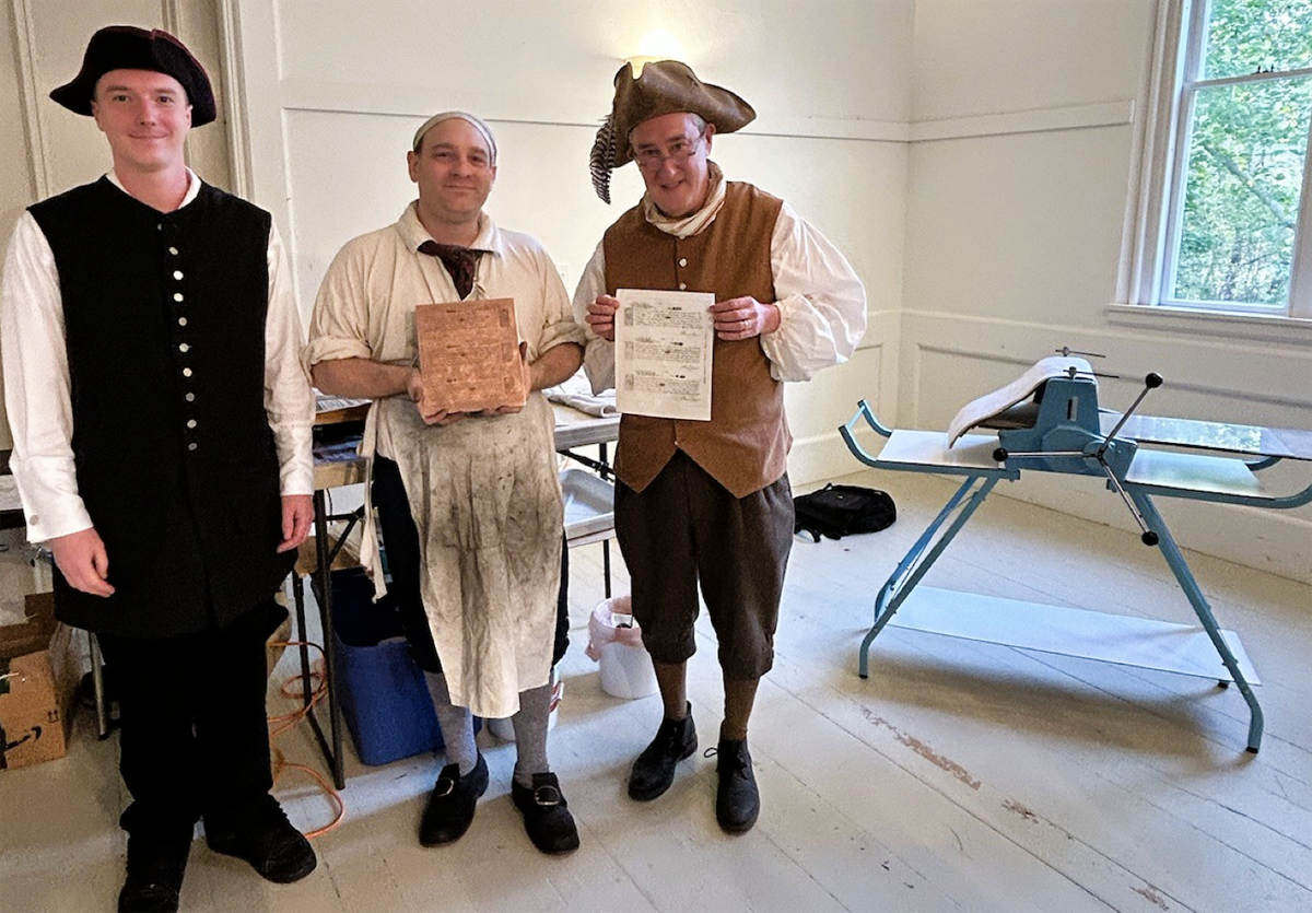 Andy Volpe holding engraving